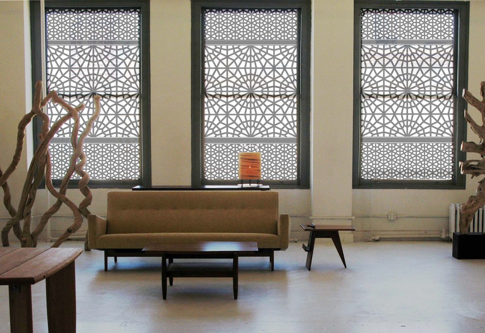 Trendy concrete floor living room photo in Other with beige walls