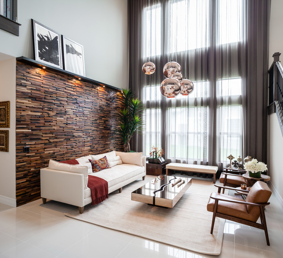 Example of a mid-sized trendy formal and open concept living room design in Miami with brown walls, no fireplace and no tv
