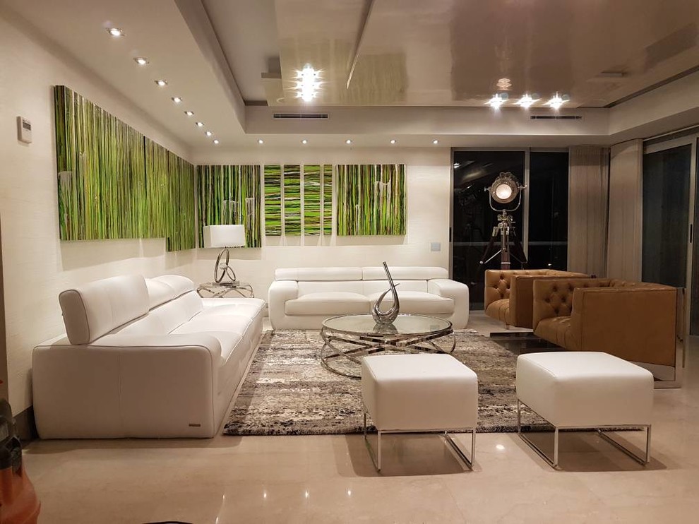 Example of a large minimalist formal and loft-style travertine floor and beige floor living room design in Miami with white walls, no fireplace and no tv