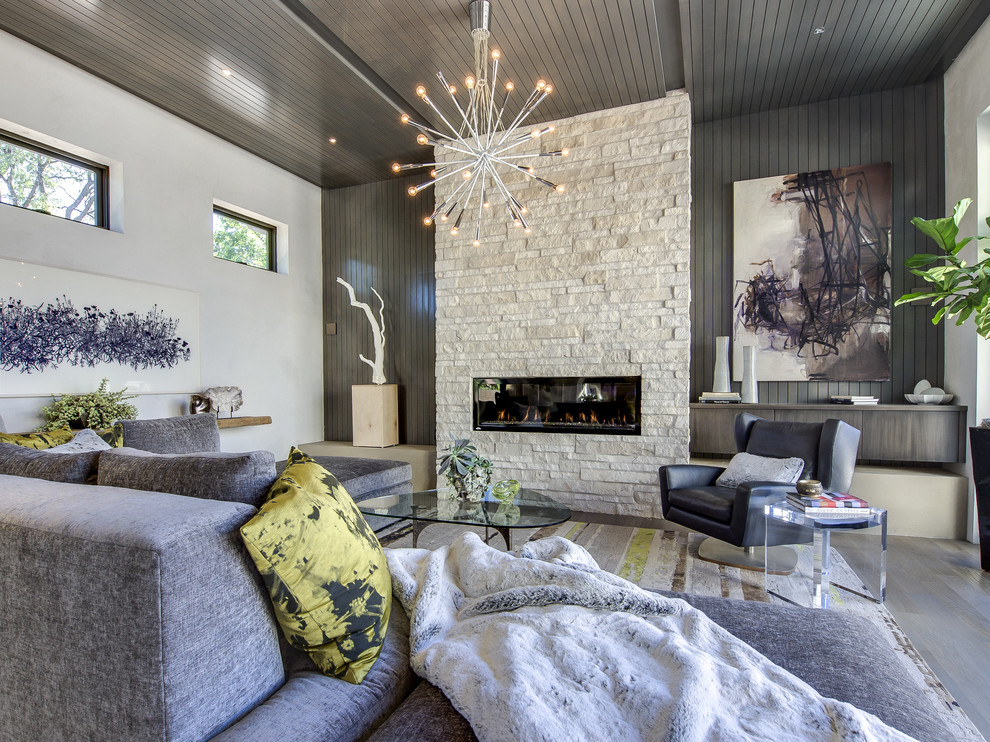 Contemporary living room in Denver with a ribbon fireplace.