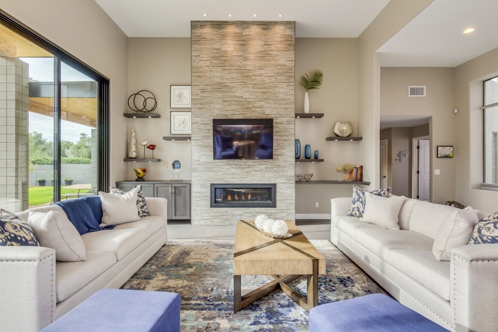 Inspiration for a large contemporary open concept porcelain tile and gray floor living room remodel in Phoenix with gray walls, a tile fireplace and a wall-mounted tv