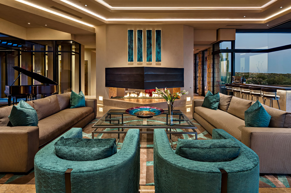 Photo of an expansive open plan living room in Phoenix with a two-sided fireplace and a music area.