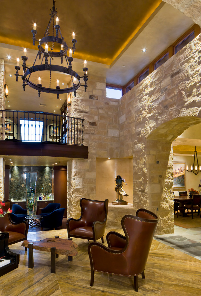 Ejemplo de salón abierto clásico con paredes beige, suelo de madera en tonos medios, arcos y piedra