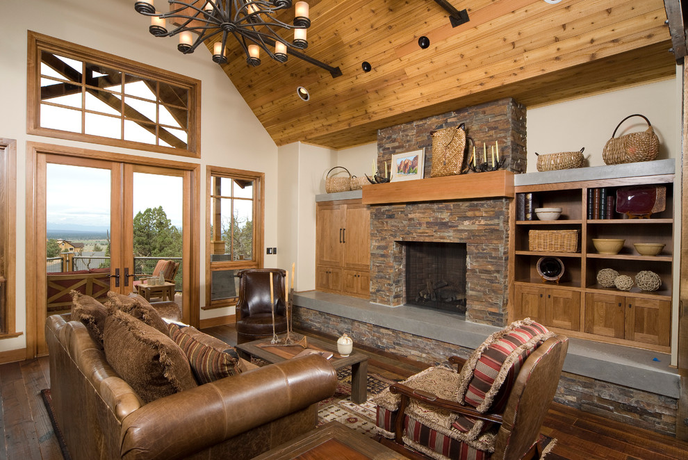 Inspiration for a large traditional living room in Portland with a standard fireplace and a stone fireplace surround.