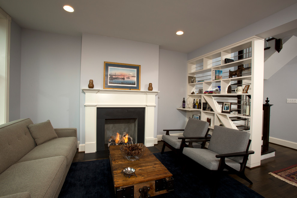 Small transitional formal and open concept dark wood floor living room photo in DC Metro with blue walls, a standard fireplace, no tv and a concrete fireplace