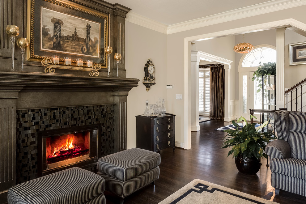 Inspiration for a small transitional formal and open concept dark wood floor living room remodel in Kansas City with gray walls, a standard fireplace, a tile fireplace and no tv