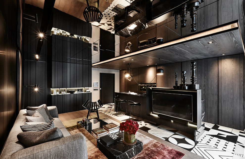 This is an example of a contemporary open plan living room in Singapore with black walls, a built-in media unit and white floors.