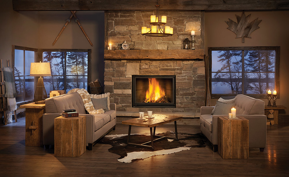 Inspiration for a medium sized rustic enclosed living room in Toronto with beige walls, dark hardwood flooring, a ribbon fireplace, a stone fireplace surround and brown floors.