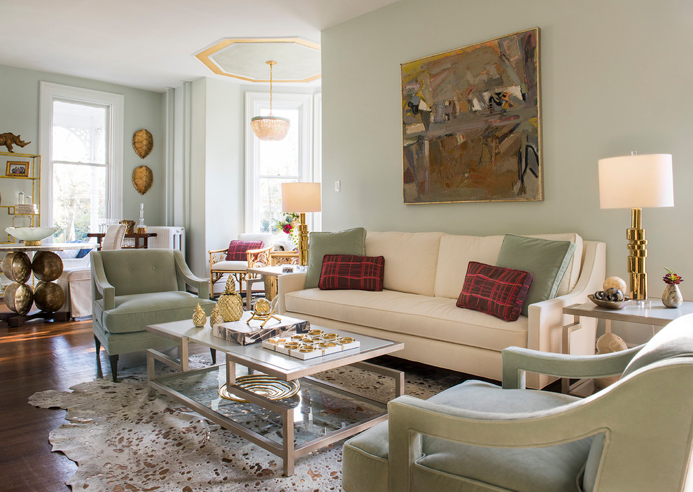 Foto di un grande soggiorno classico aperto con pareti verdi, pavimento in legno massello medio, nessuna TV e sala formale