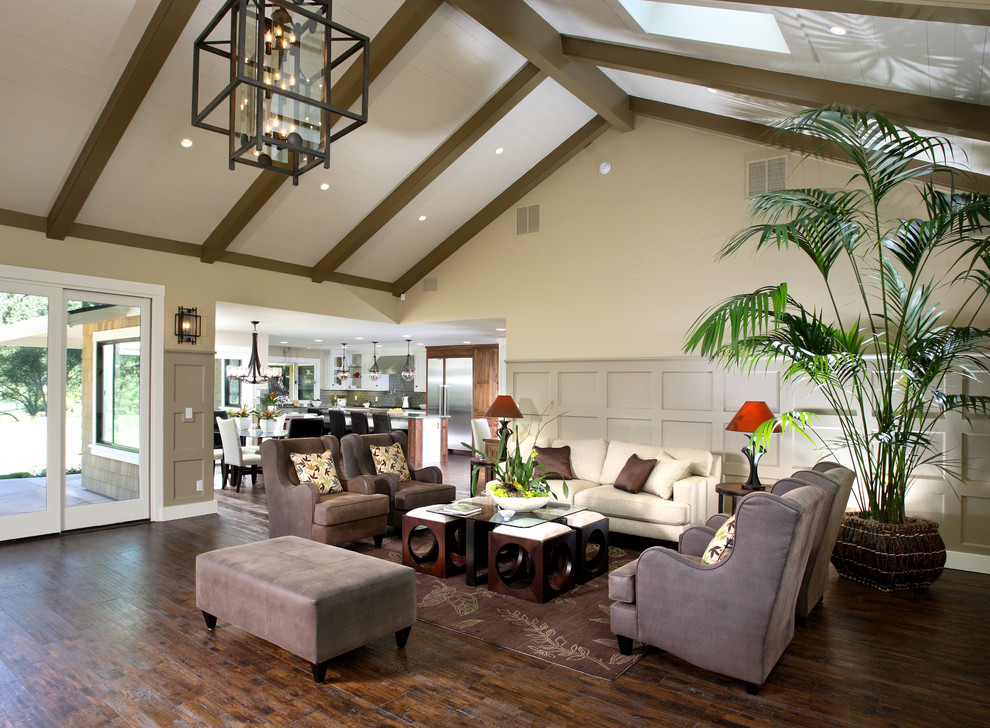 Inspiration for a large classic formal open plan living room in San Francisco with beige walls, medium hardwood flooring, a standard fireplace, a stone fireplace surround and no tv.