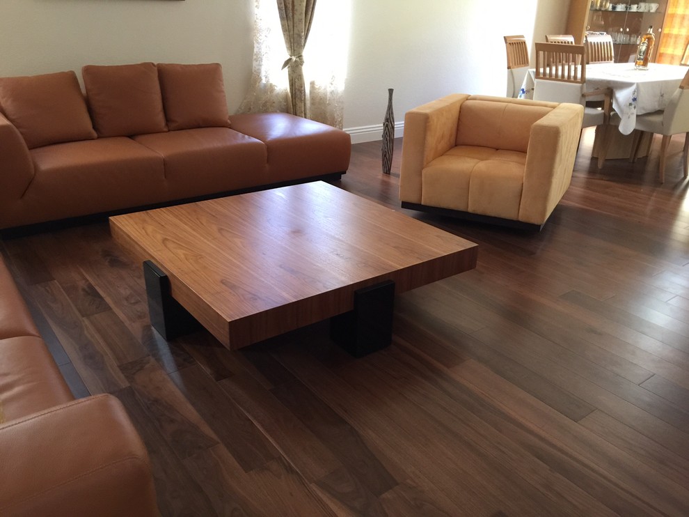 Inspiration for a traditional living room in Los Angeles with dark hardwood flooring.