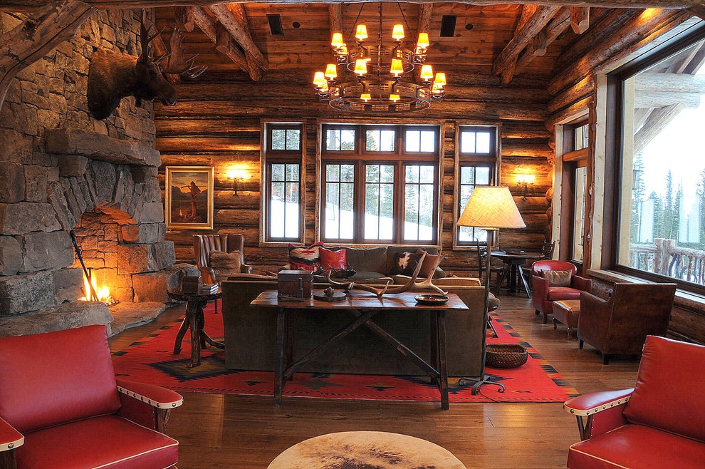 Living room - rustic dark wood floor living room idea in Atlanta with a stone fireplace