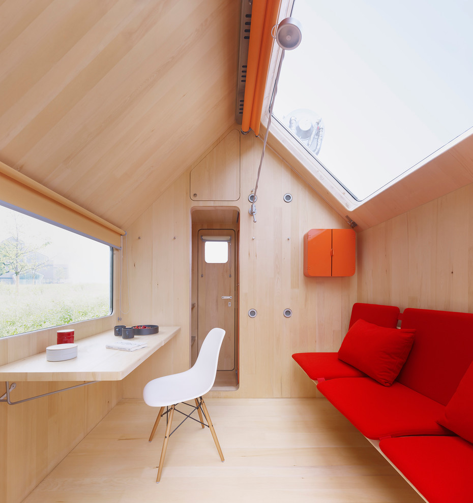 Photo of a small modern living room in Other with light hardwood flooring.