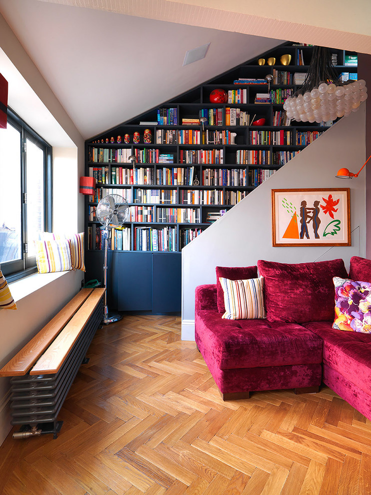Living room - eclectic medium tone wood floor living room idea in London