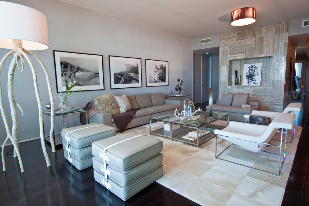 Example of a large trendy black floor living room design in Miami with gray walls
