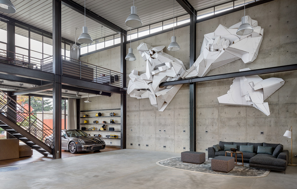 Idées déco pour un très grand salon industriel avec un mur gris, sol en béton ciré et un sol gris.