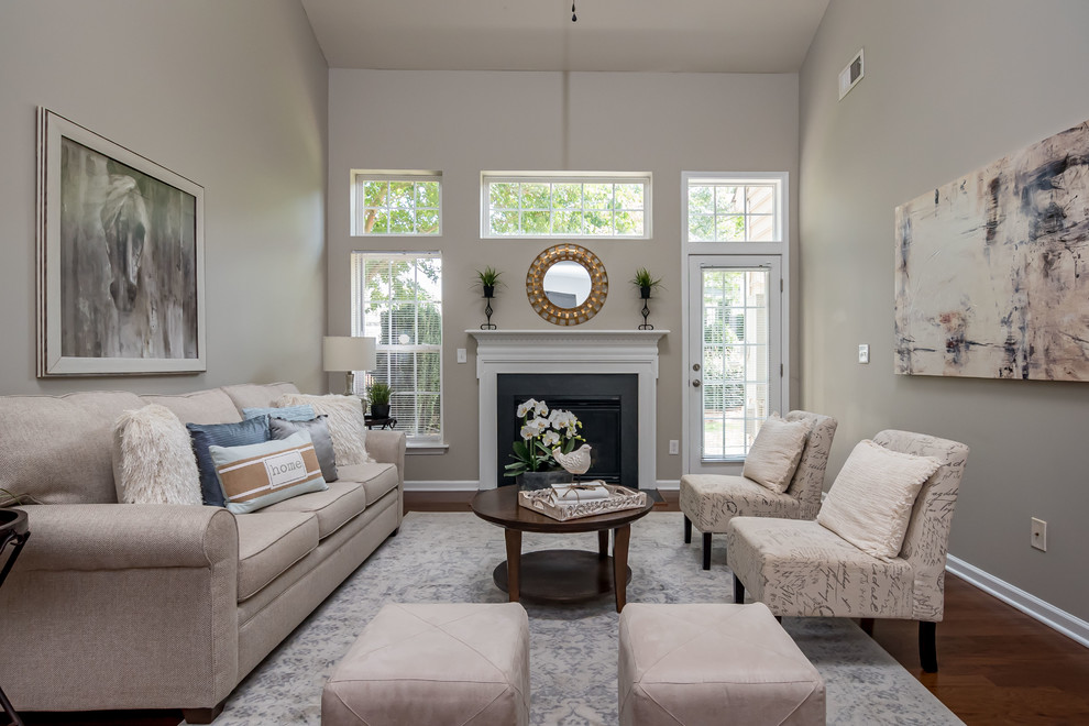 Design ideas for a small classic living room in Charlotte with grey walls.
