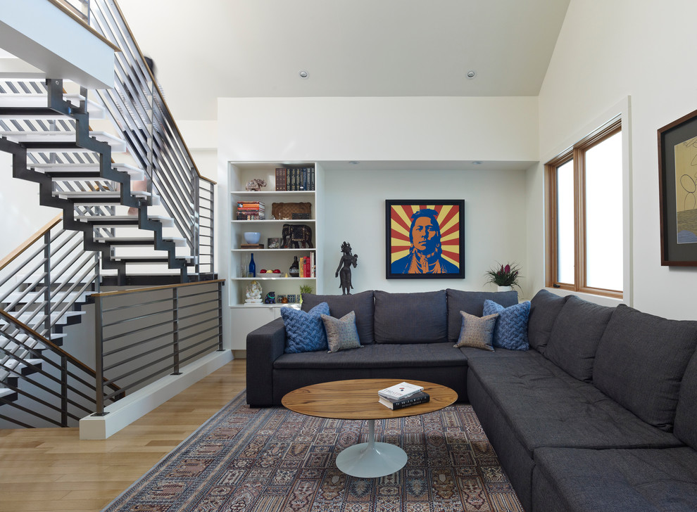 Minimalist medium tone wood floor living room photo in San Francisco with white walls