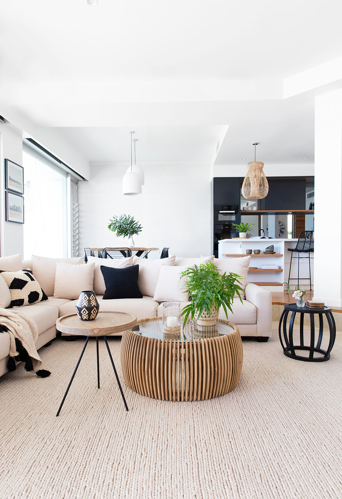 Beach style living room photo in Gold Coast - Tweed with white walls