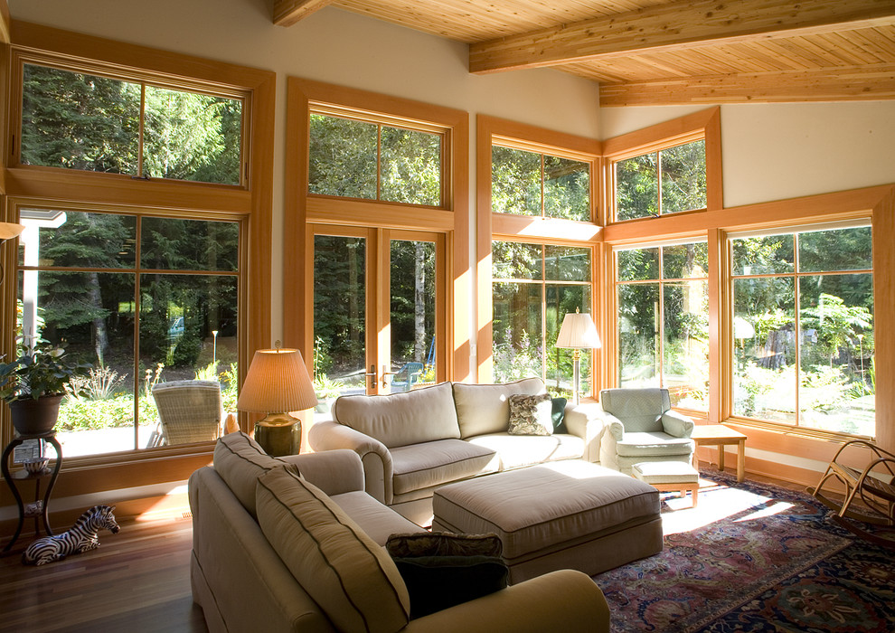 This is an example of a contemporary open plan living room in Seattle with beige walls.