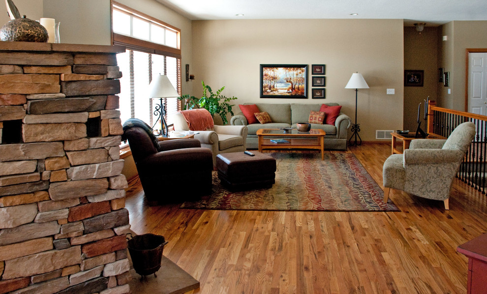 Example of a transitional medium tone wood floor living room design in Salt Lake City