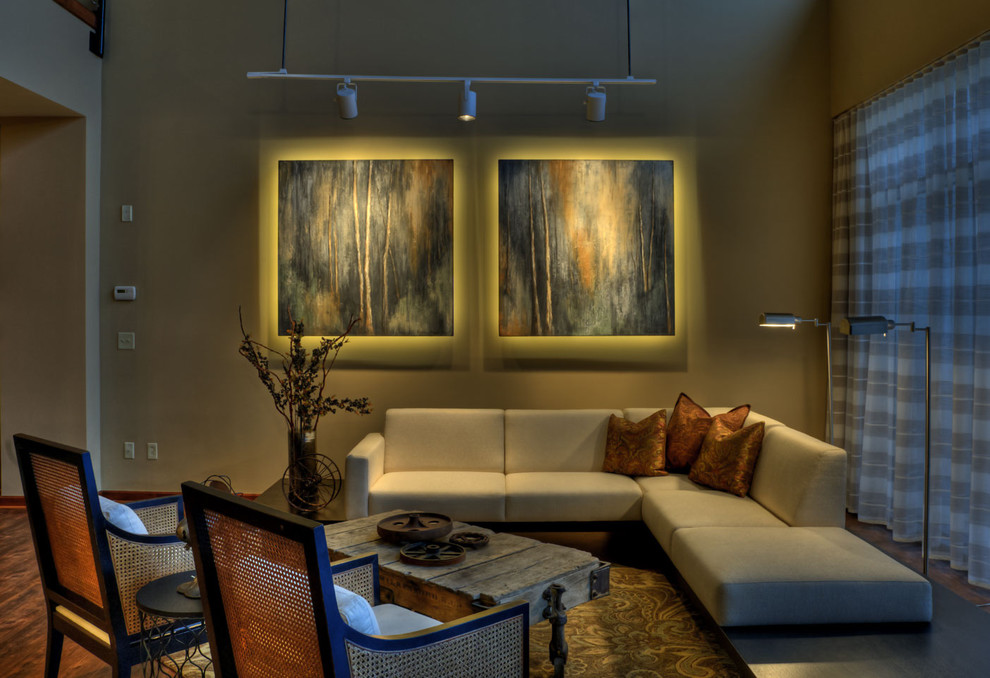 Inspiration for a contemporary formal and open concept dark wood floor and brown floor living room remodel in Wichita with beige walls and no tv