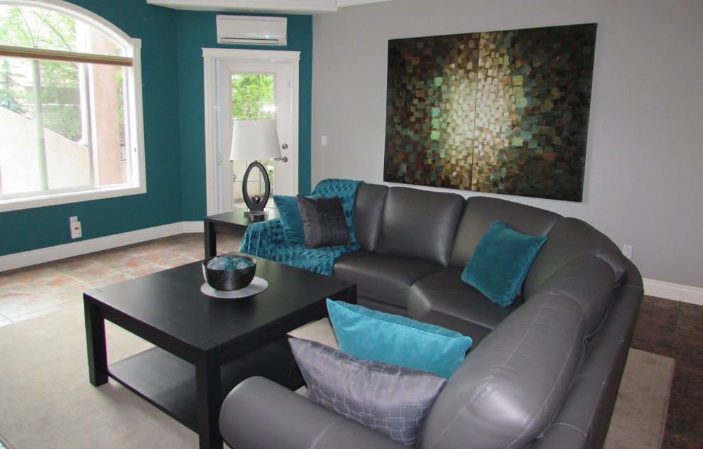 Design ideas for a classic grey and teal living room in Edmonton.