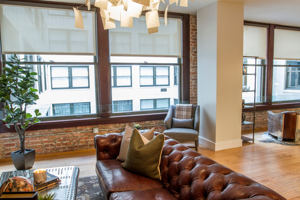 Small industrial formal mezzanine living room in Los Angeles with white walls, light hardwood flooring, a wall mounted tv, no fireplace and beige floors.