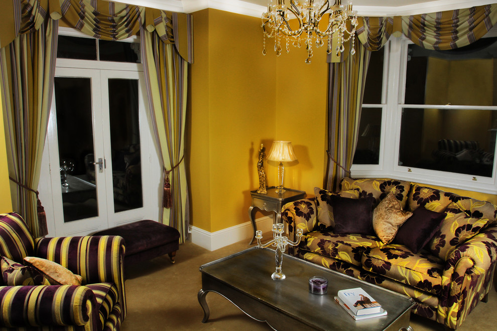 Inspiration for a medium sized classic formal enclosed living room in London with yellow walls, carpet, a standard fireplace and no tv.