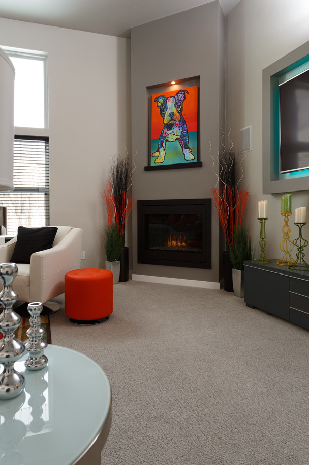Example of a huge minimalist open concept carpeted and gray floor living room design in Other with beige walls, a corner fireplace and a plaster fireplace