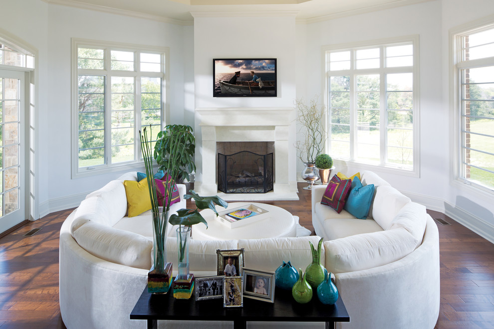 Inspiration for a contemporary living room remodel in Indianapolis with white walls, a standard fireplace and a wall-mounted tv
