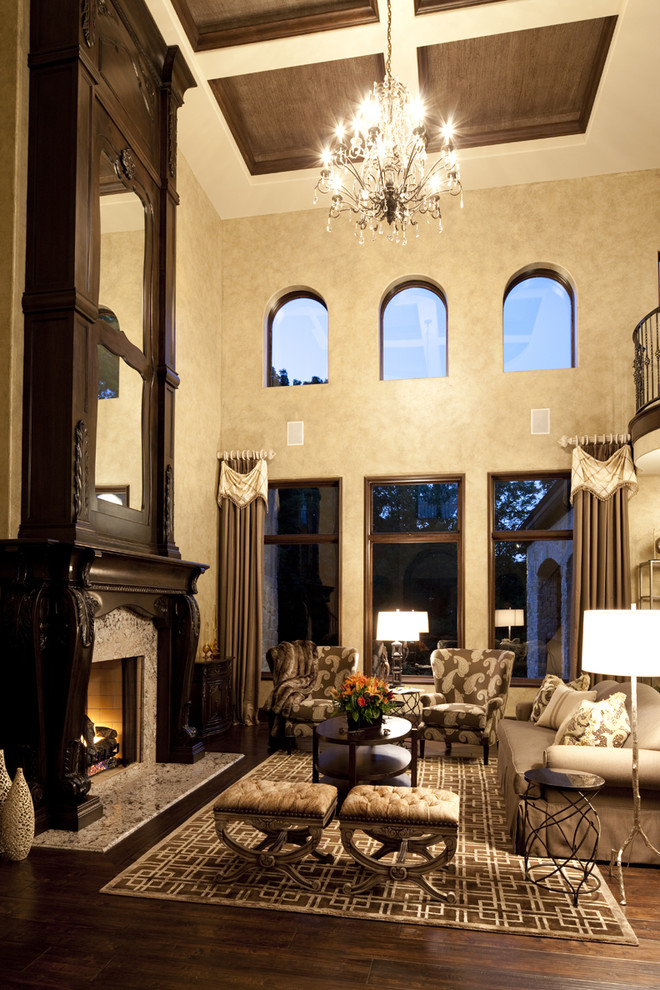 Example of a classic dark wood floor living room design in Indianapolis with beige walls and a standard fireplace