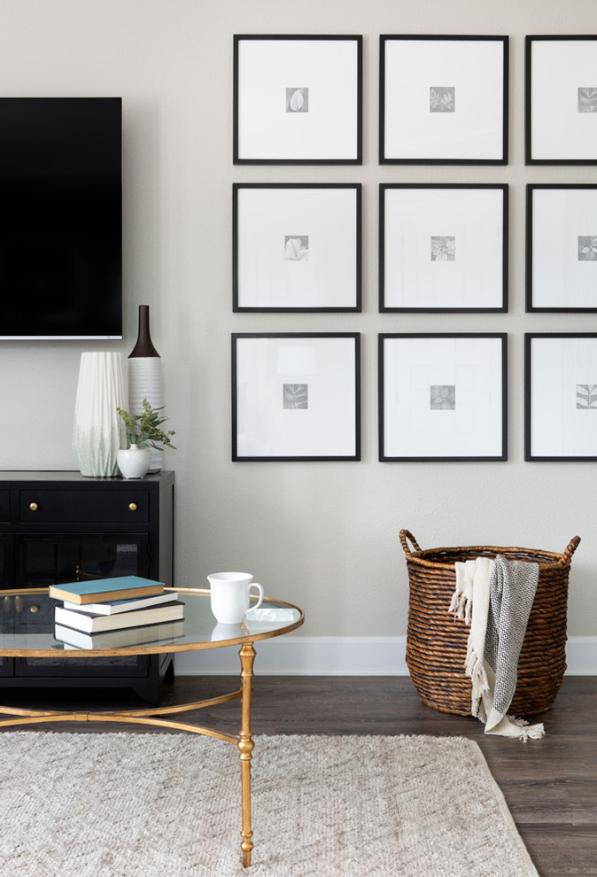 Example of a mid-sized transitional formal and loft-style dark wood floor and gray floor living room design in Austin with multicolored walls, no fireplace and a wall-mounted tv