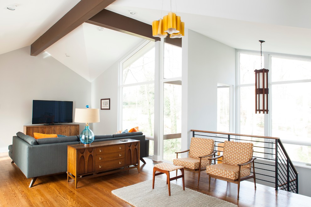 Living room - mid-century modern formal and open concept living room idea in Atlanta with a tv stand