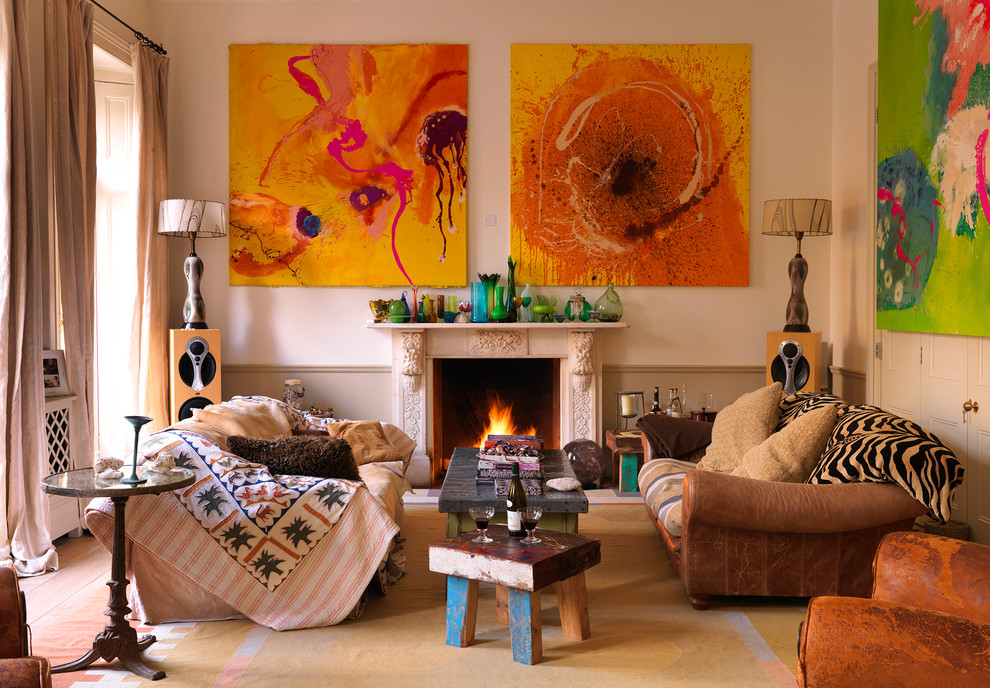 Eclectic formal living room photo in London with beige walls and a standard fireplace