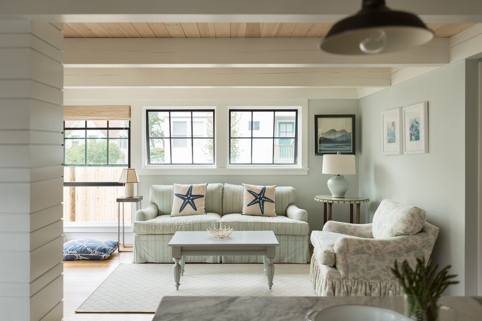 Beach style open plan living room in Portland Maine with blue walls.
