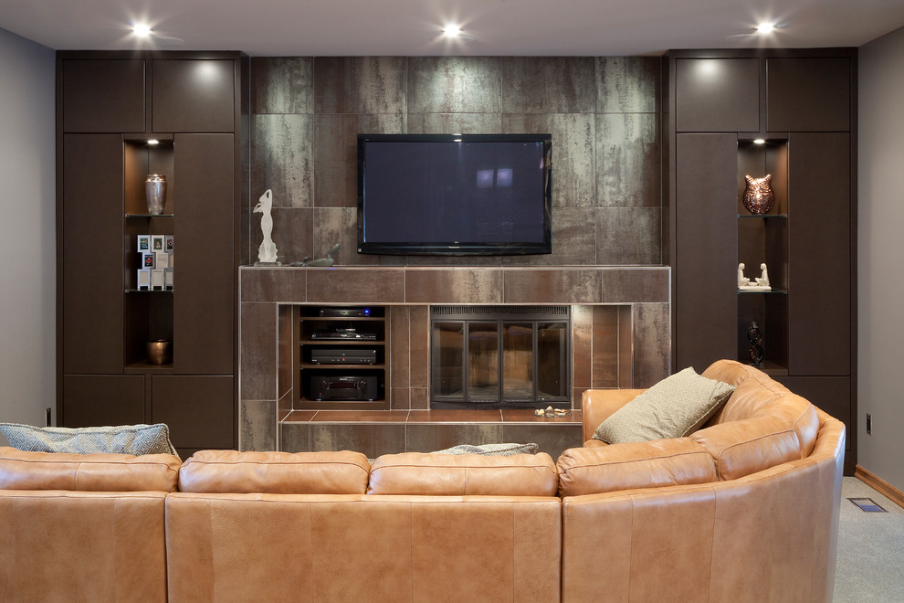 Photo of a medium sized contemporary living room in Other with a built-in media unit, carpet, a standard fireplace and grey floors.