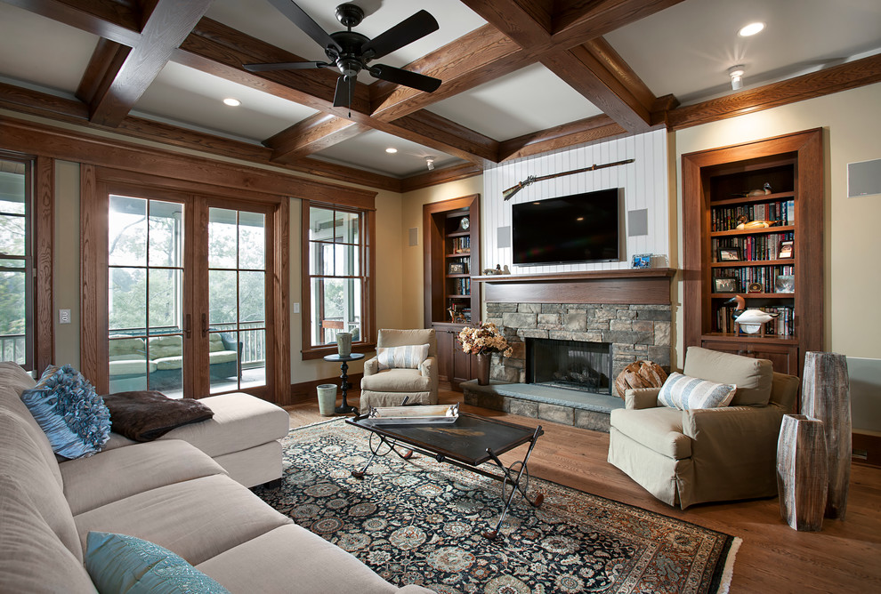 Inspiration for a rustic living room remodel in Charleston with a standard fireplace and a stone fireplace