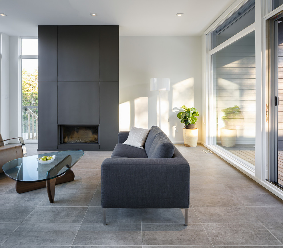 Minimalist formal and open concept concrete floor living room photo in Ottawa with white walls and a standard fireplace