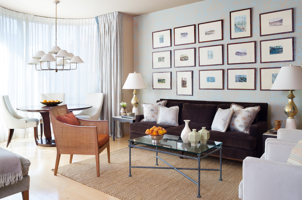 This is an example of a medium sized classic formal open plan living room in Boston with light hardwood flooring, beige floors, beige walls, no fireplace, no tv and feature lighting.