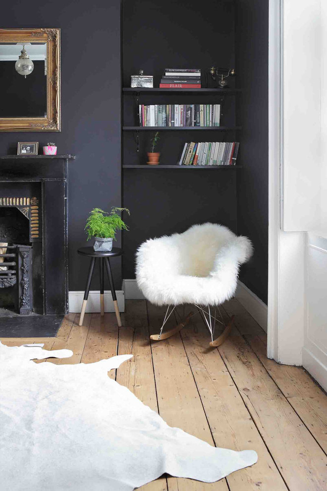 Photo of a bohemian living room in Dublin with black walls.