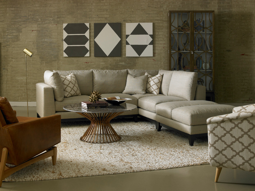 Ispirazione per un soggiorno minimalista stile loft con pareti beige e pavimento in cemento