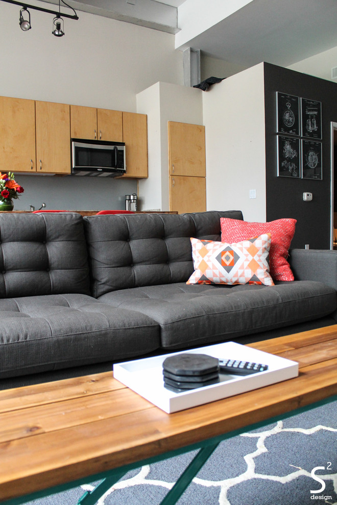 Urban mezzanine living room in Houston with grey walls, medium hardwood flooring and a freestanding tv.