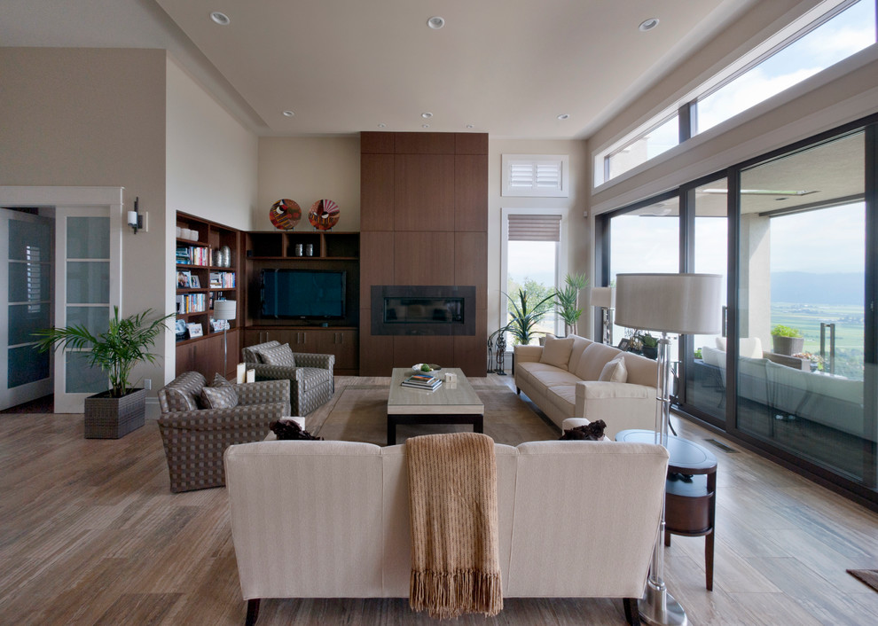 Design ideas for a contemporary living room in Vancouver with a ribbon fireplace and a built-in media unit.