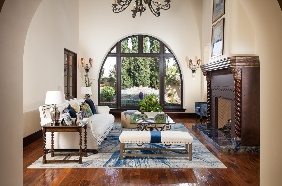 Tuscan open concept living room photo in Orange County