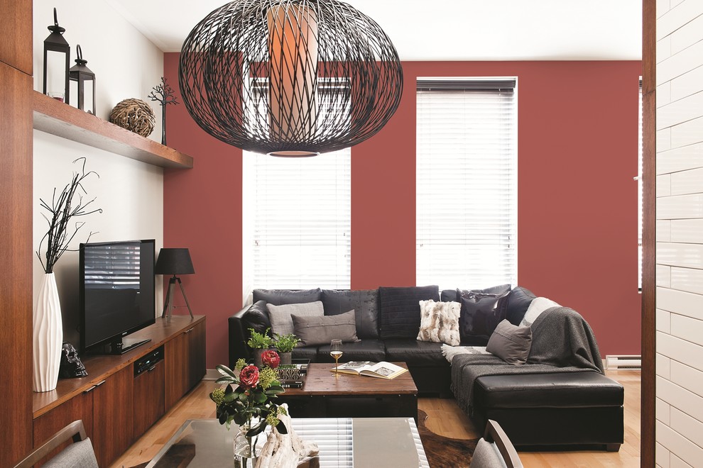 Ispirazione per un soggiorno design con pareti rosse