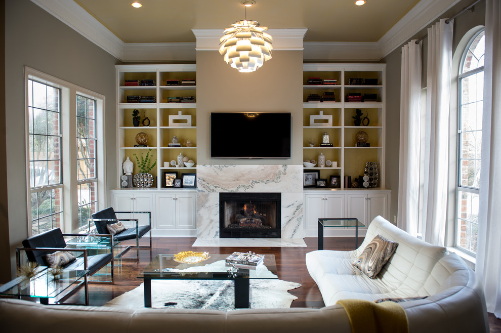 Living room - large contemporary open concept dark wood floor living room idea in New Orleans with gray walls, a wall-mounted tv, a standard fireplace and a stone fireplace