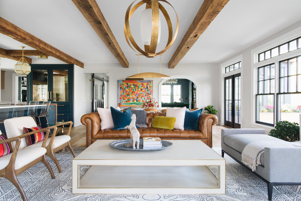 Living room - mid-sized transitional enclosed living room idea in Grand Rapids with white walls