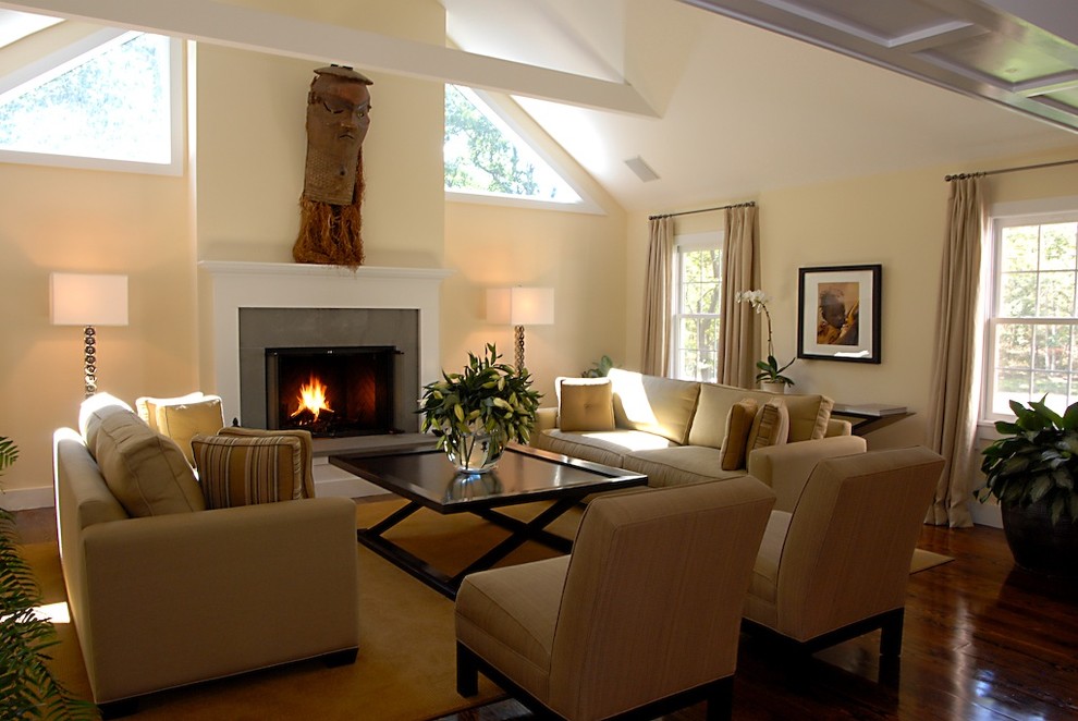 Photo of a medium sized modern formal open plan living room in Orange County with beige walls, dark hardwood flooring, a standard fireplace, a stone fireplace surround and brown floors.