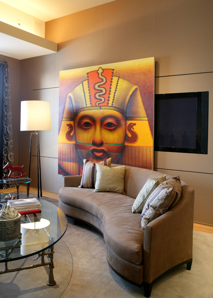 This is an example of a contemporary living room in Chicago with beige walls and a wall mounted tv.